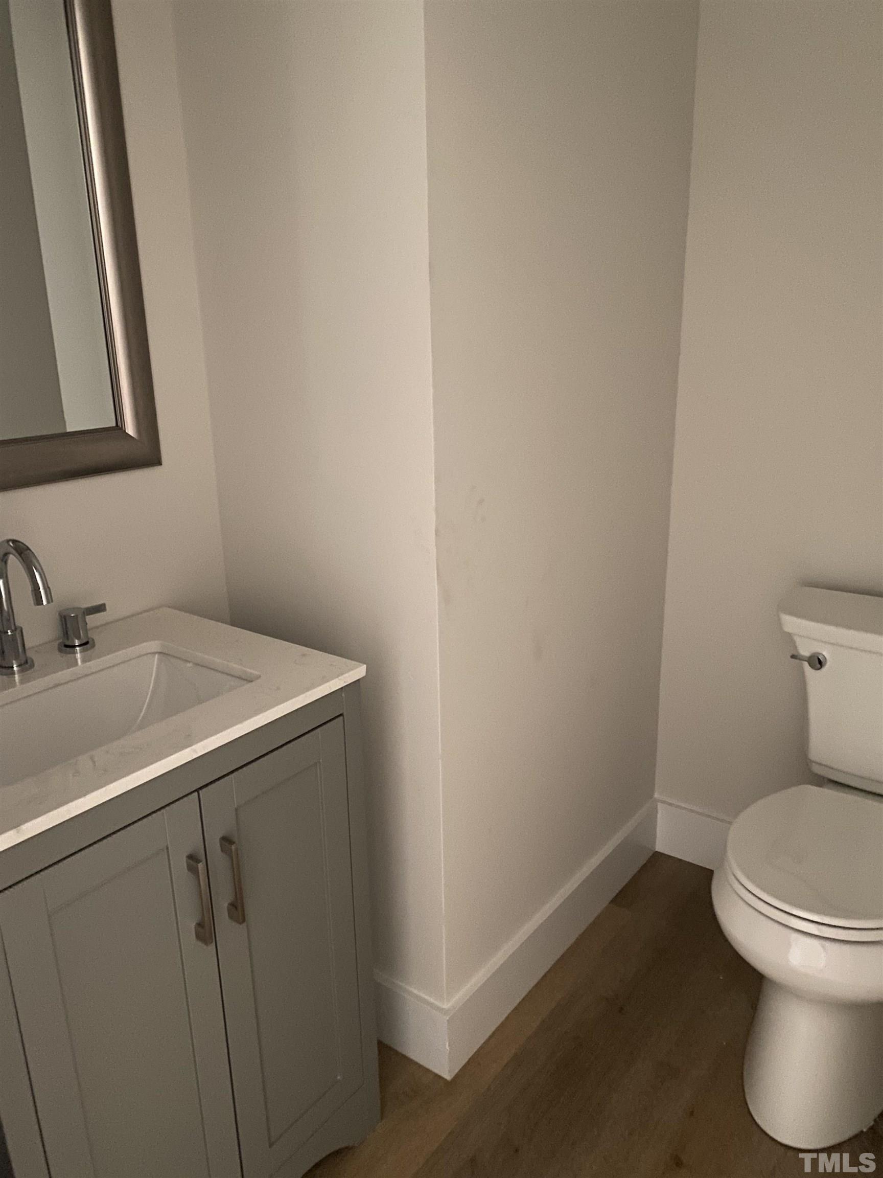 1108 Hammerman Drive Willow Spring, NC 27592 - Photo 12 of 22 a bathroom with a sink and a toilet