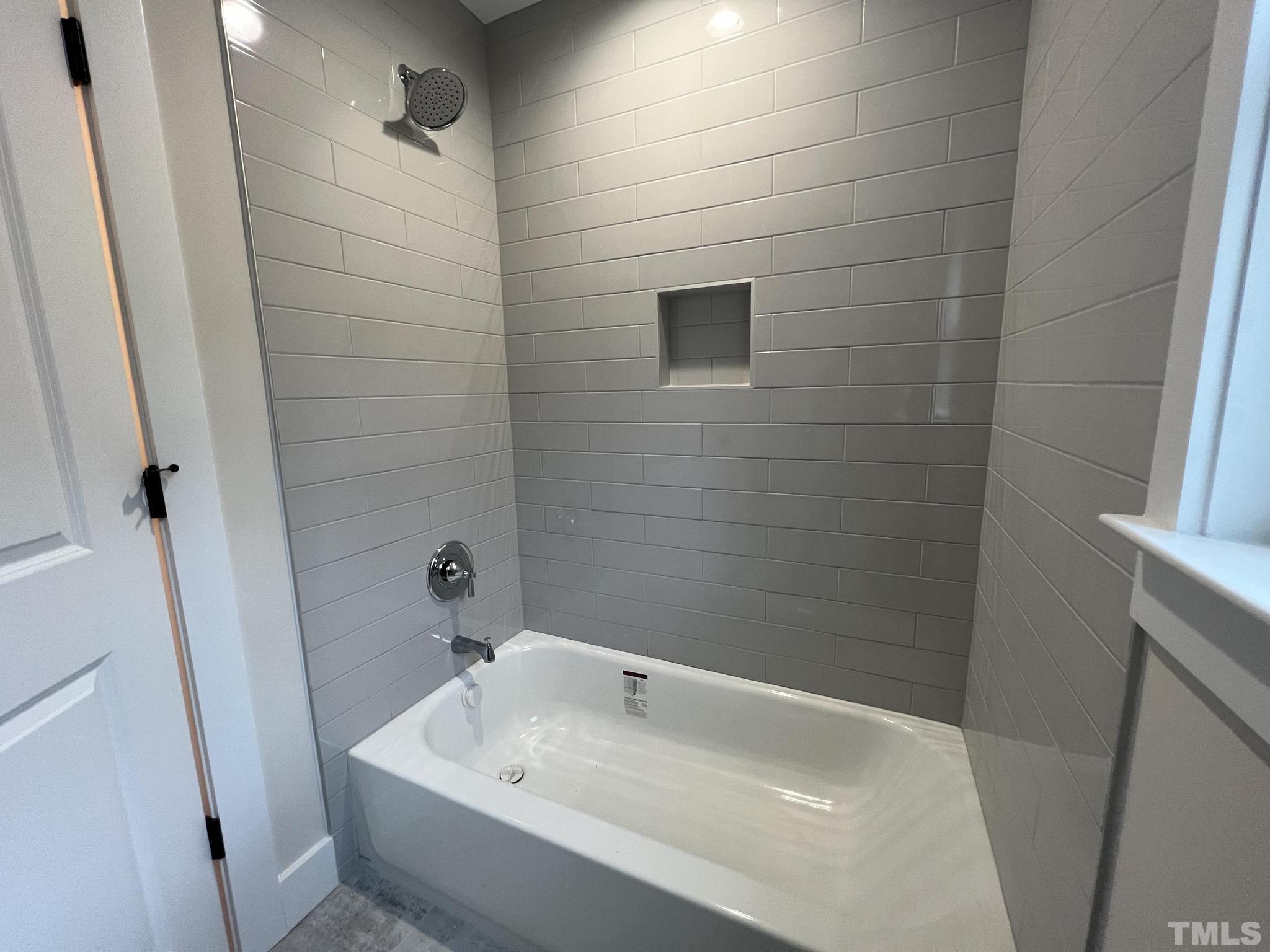 1108 Hammerman Drive Willow Spring, NC 27592 - Photo 15 of 22 a bathroom with a sink and shower