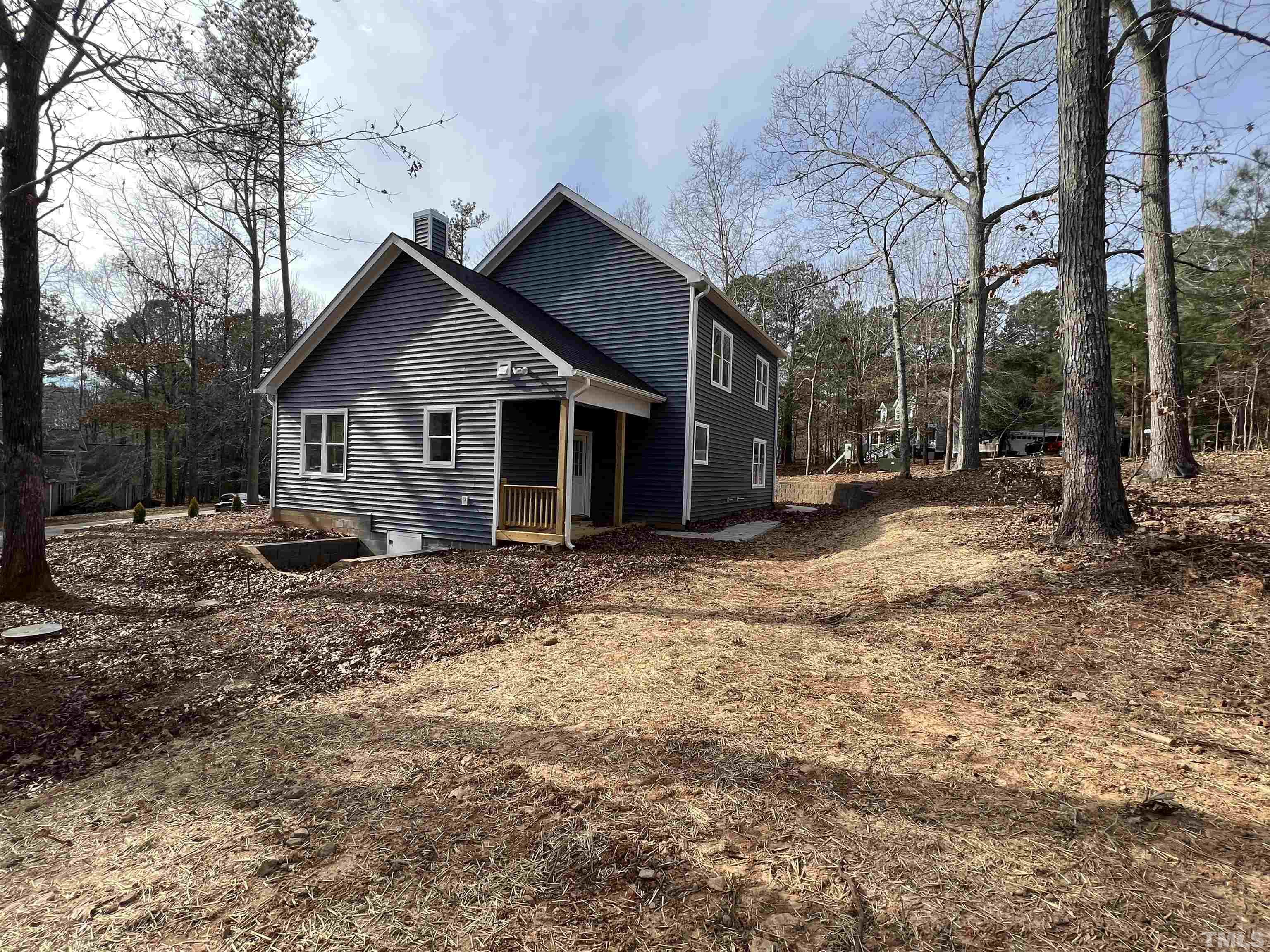 1108 Hammerman Drive Willow Spring, NC 27592 - Photo 19 of 22 a view of a house with a yard covered in snow