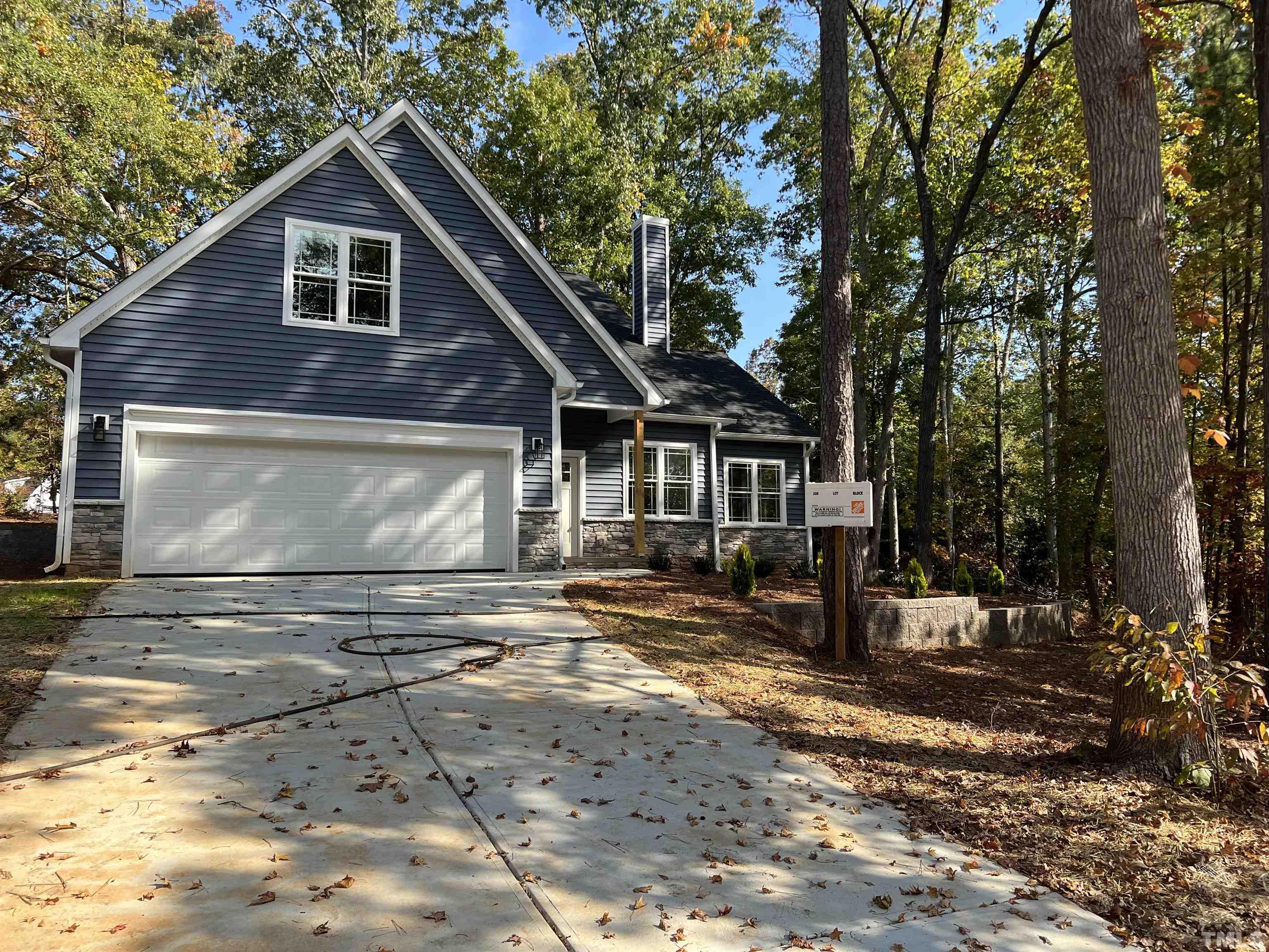 1108 Hammerman Drive Willow Spring, NC 27592 - Photo 21 of 22 a front view of a house with a yard