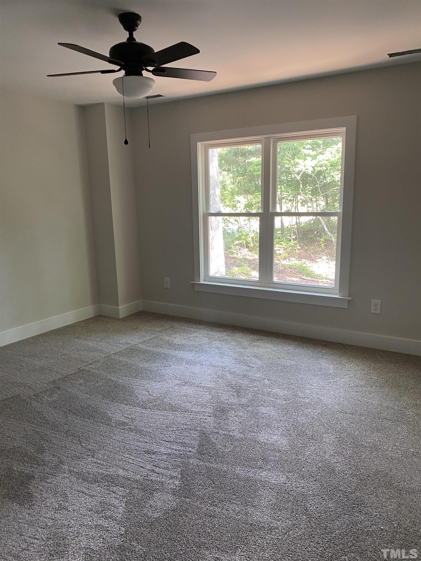 1108 Hammerman Drive Willow Spring, NC 27592 - Photo 6 of 22 an empty room with a window