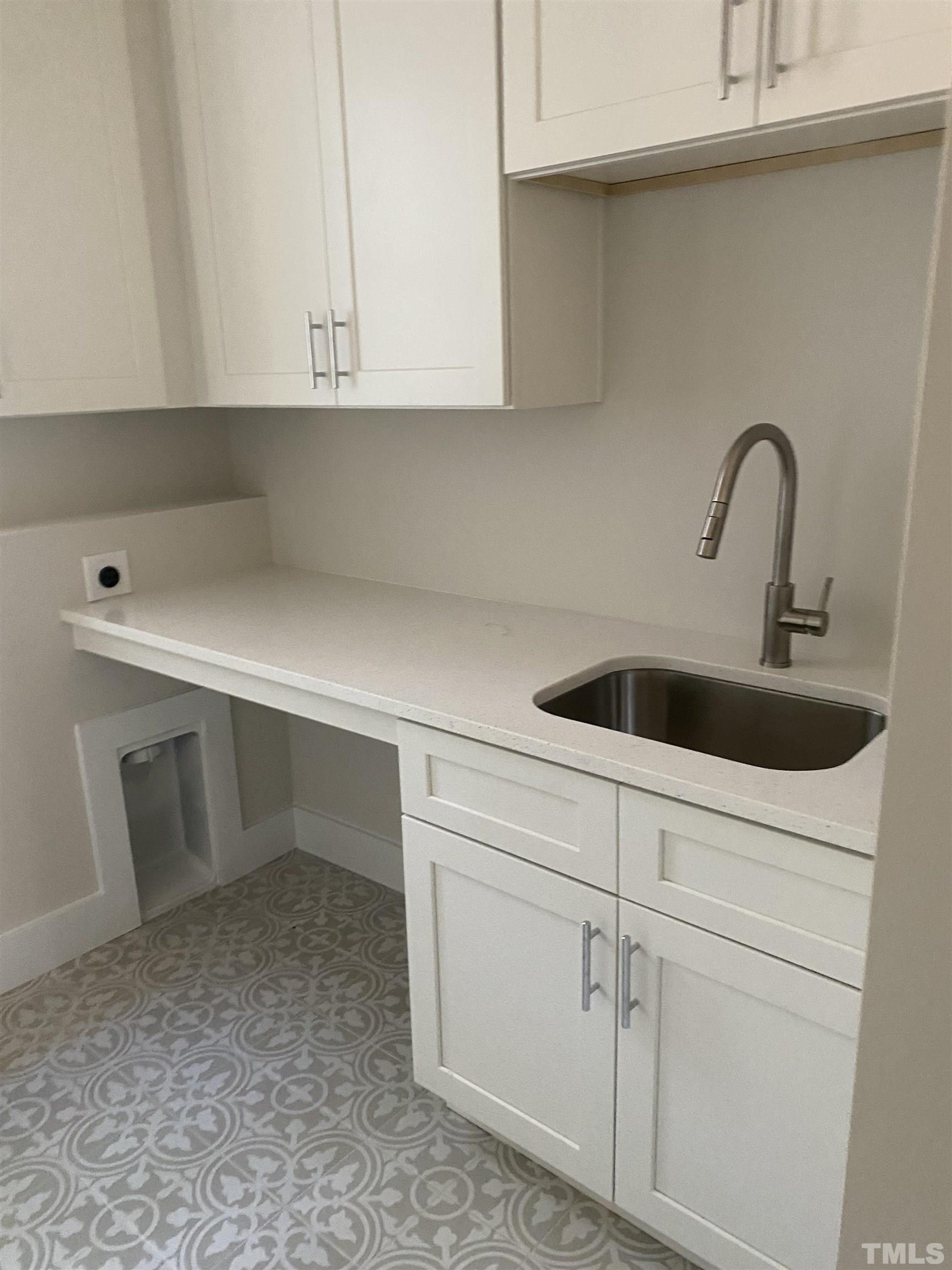 1108 Hammerman Drive Willow Spring, NC 27592 - Photo 10 of 22 a kitchen with white cabinets appliances and sink
