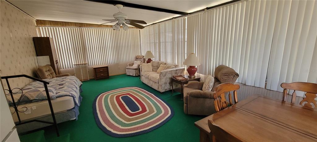 100 Pine Drive Kenansville, FL 34739 - Photo 24 of 34 a living room with furniture and a large window