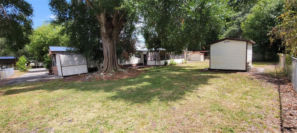 100 Pine Drive Kenansville, FL 34739 - Photo 30 of 34 a view of a back yard of the house