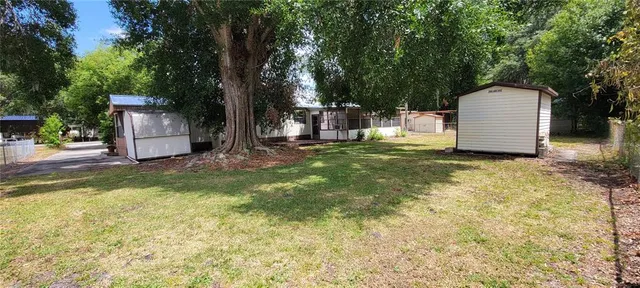 a view of a swimming pool with a yard