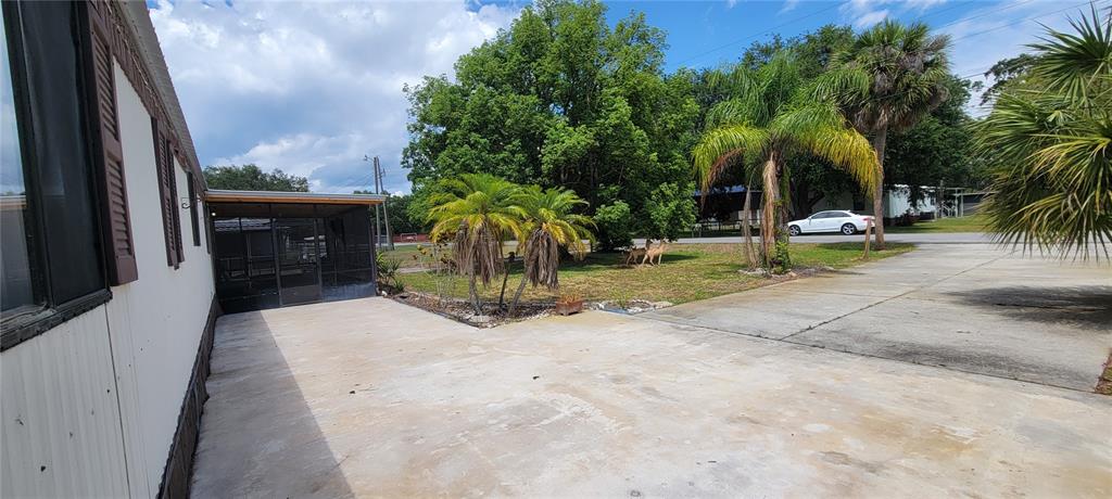 100 Pine Drive Kenansville, FL 34739 - Photo 6 of 34 a view of outdoor space yard and porch
