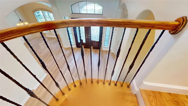 a view of a balcony with wooden floor