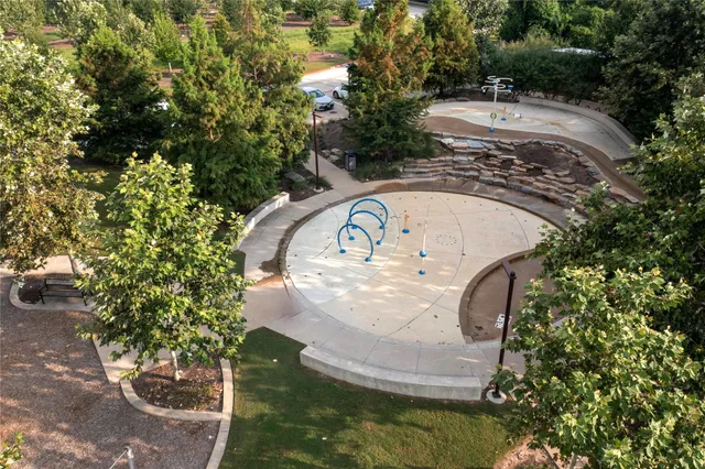 a view of a swimming pool with a yard