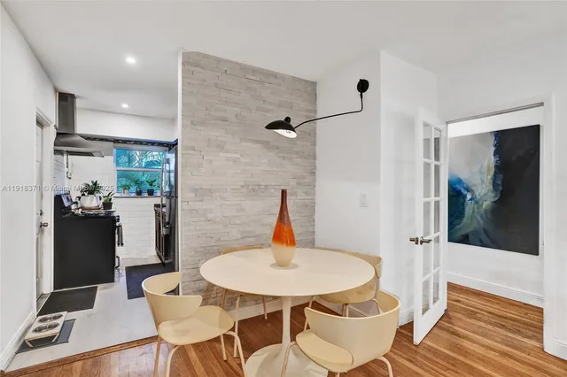 a kitchen with stainless steel appliances a refrigerator sink and cabinets