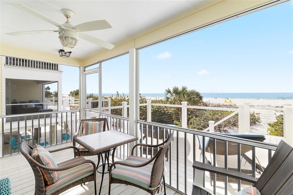 460-5 Gulf Boulevard, Unit 4 Boca Grande, FL 33921 - Photo 11 of 26 a view of a city from a balcony with furniture