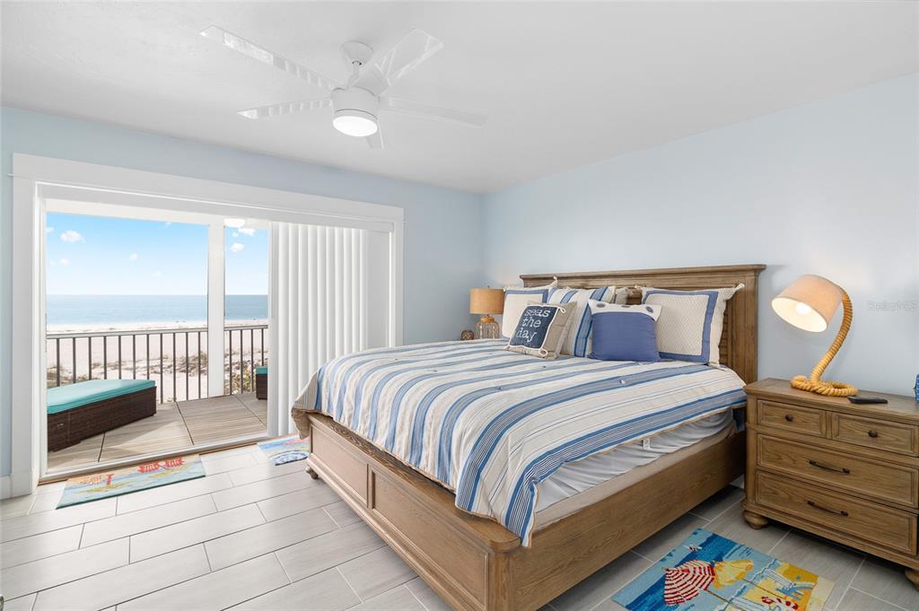 460-5 Gulf Boulevard, Unit 4 Boca Grande, FL 33921 - Photo 15 of 26 a bedroom with a bed and a window