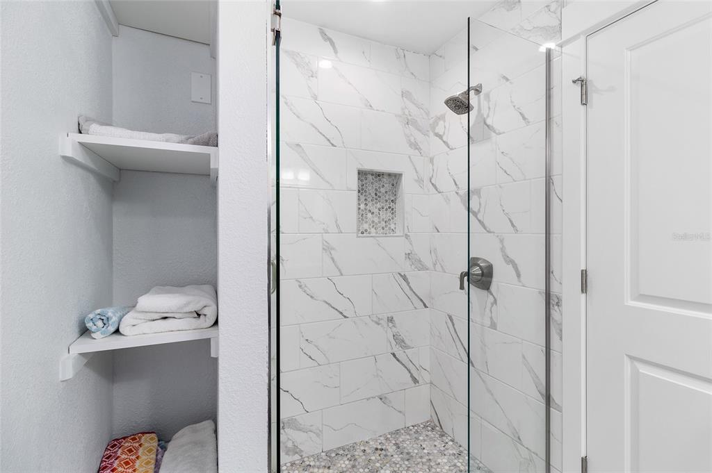 460-5 Gulf Boulevard, Unit 4 Boca Grande, FL 33921 - Photo 19 of 26 a bathroom with a shower