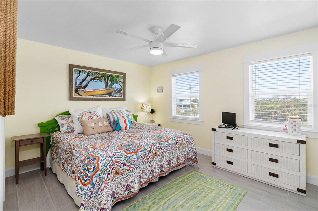 460-5 Gulf Boulevard, Unit 4 Boca Grande, FL 33921 - Photo 20 of 26 a bedroom with a bed and a window