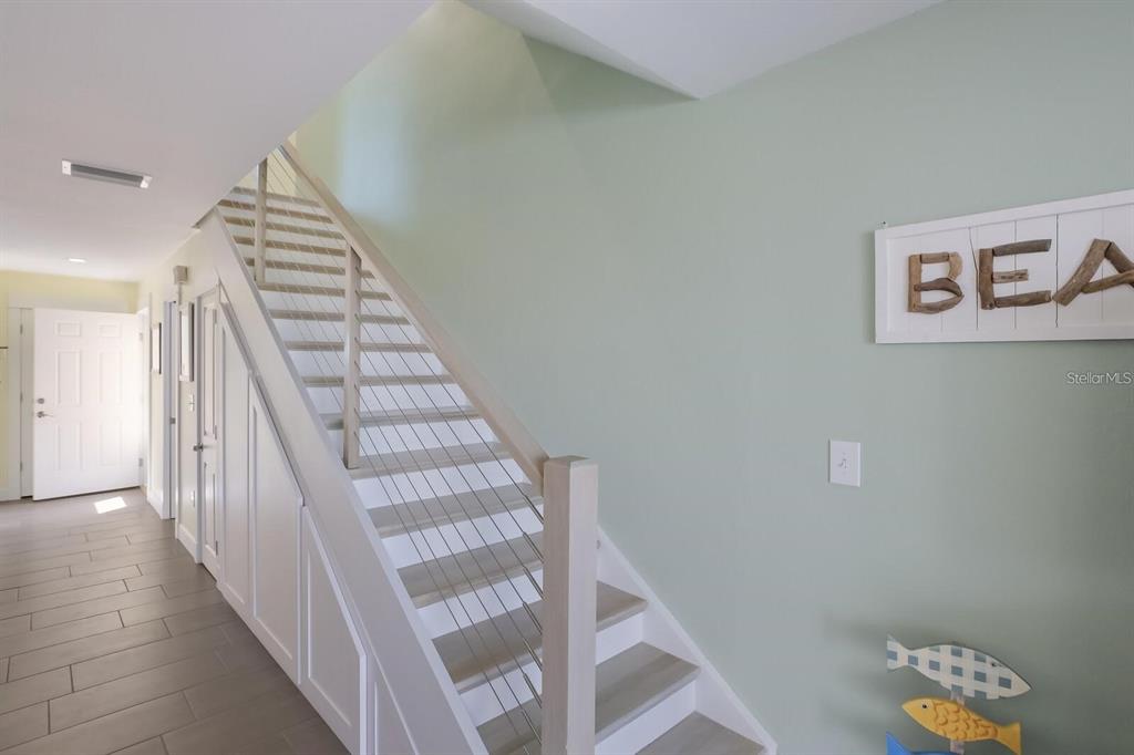 460-5 Gulf Boulevard, Unit 4 Boca Grande, FL 33921 - Photo 23 of 26 a view of entryway and hall with wooden floor