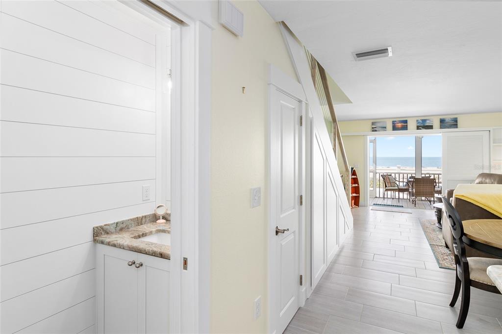 460-5 Gulf Boulevard, Unit 4 Boca Grande, FL 33921 - Photo 7 of 26 a view of a hallway to a livingroom with furniture