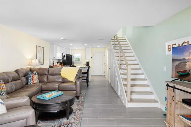 a view of a city from a balcony with furniture