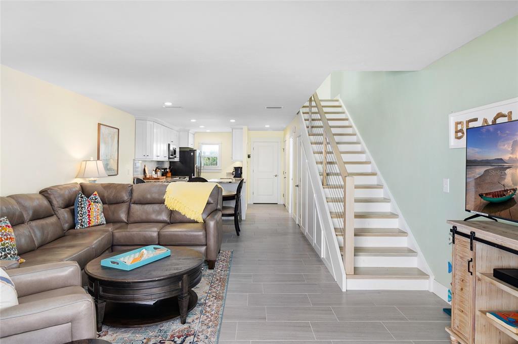 460-5 Gulf Boulevard, Unit 4 Boca Grande, FL 33921 - Photo 10 of 26 a living room with furniture and a wooden floor