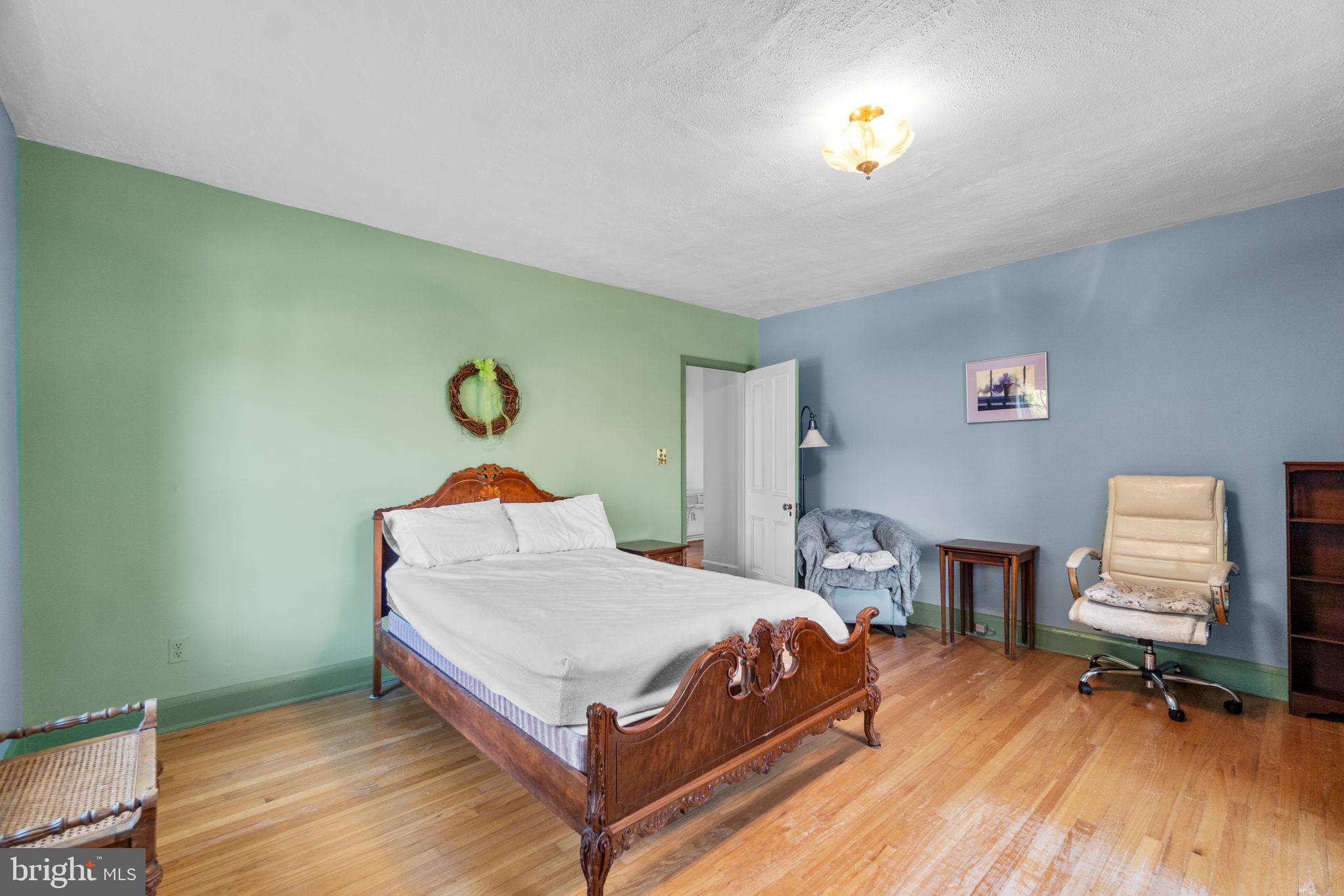 3 Center Road Baltimore, MD 21286 - Photo 39 of 57 a bedroom with a bed and wooden floor
