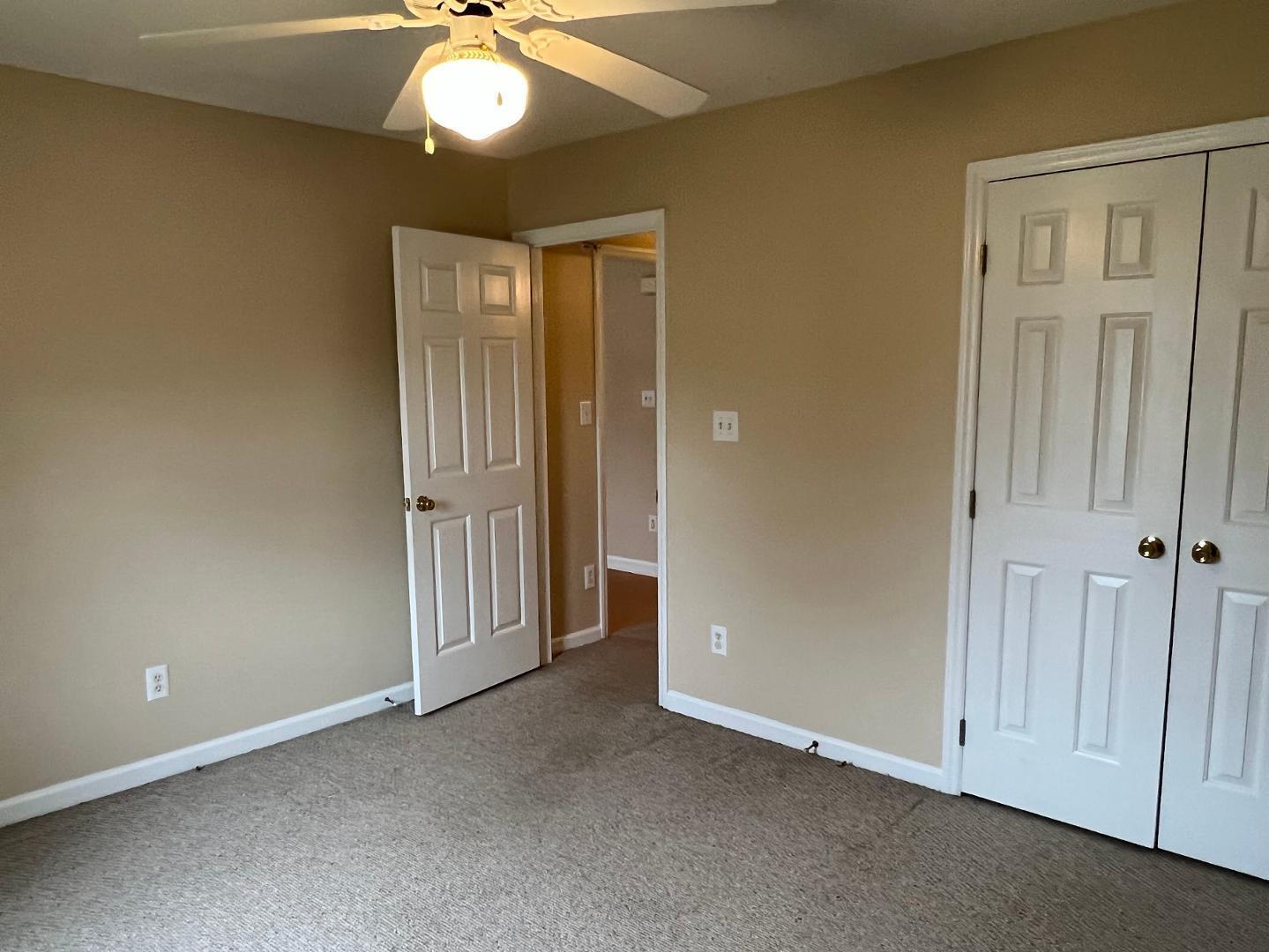 106 Bald Drive Clayton, NC 27520 - Photo 11 of 37 an empty room with chandelier fan