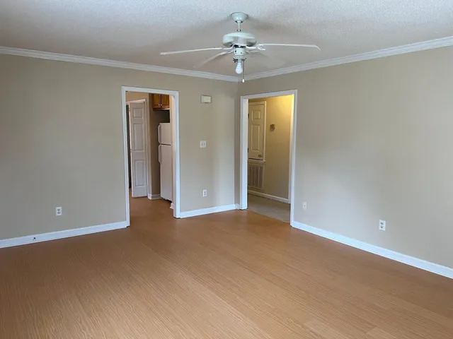 a view of an empty room with a window