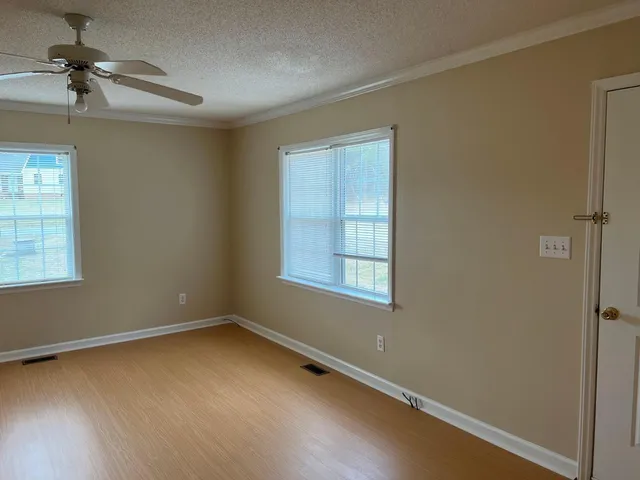 an empty room with a empty space and a window