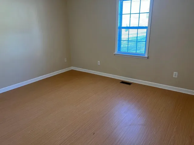 a kitchen with granite countertop a sink stove and microwave