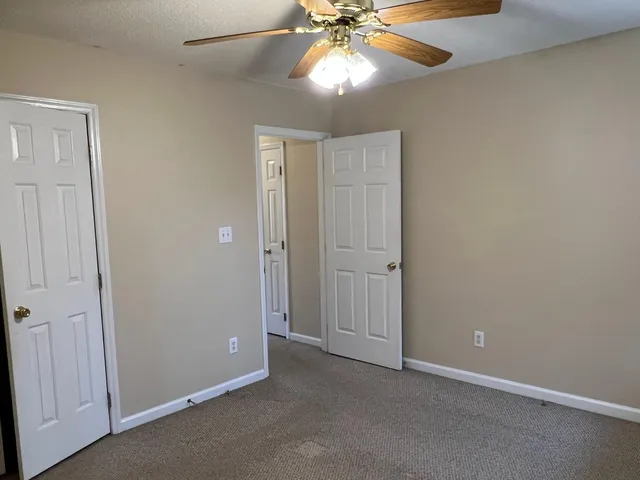 an empty room with closet area