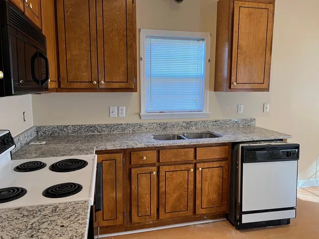 a room with a window and wooden floor