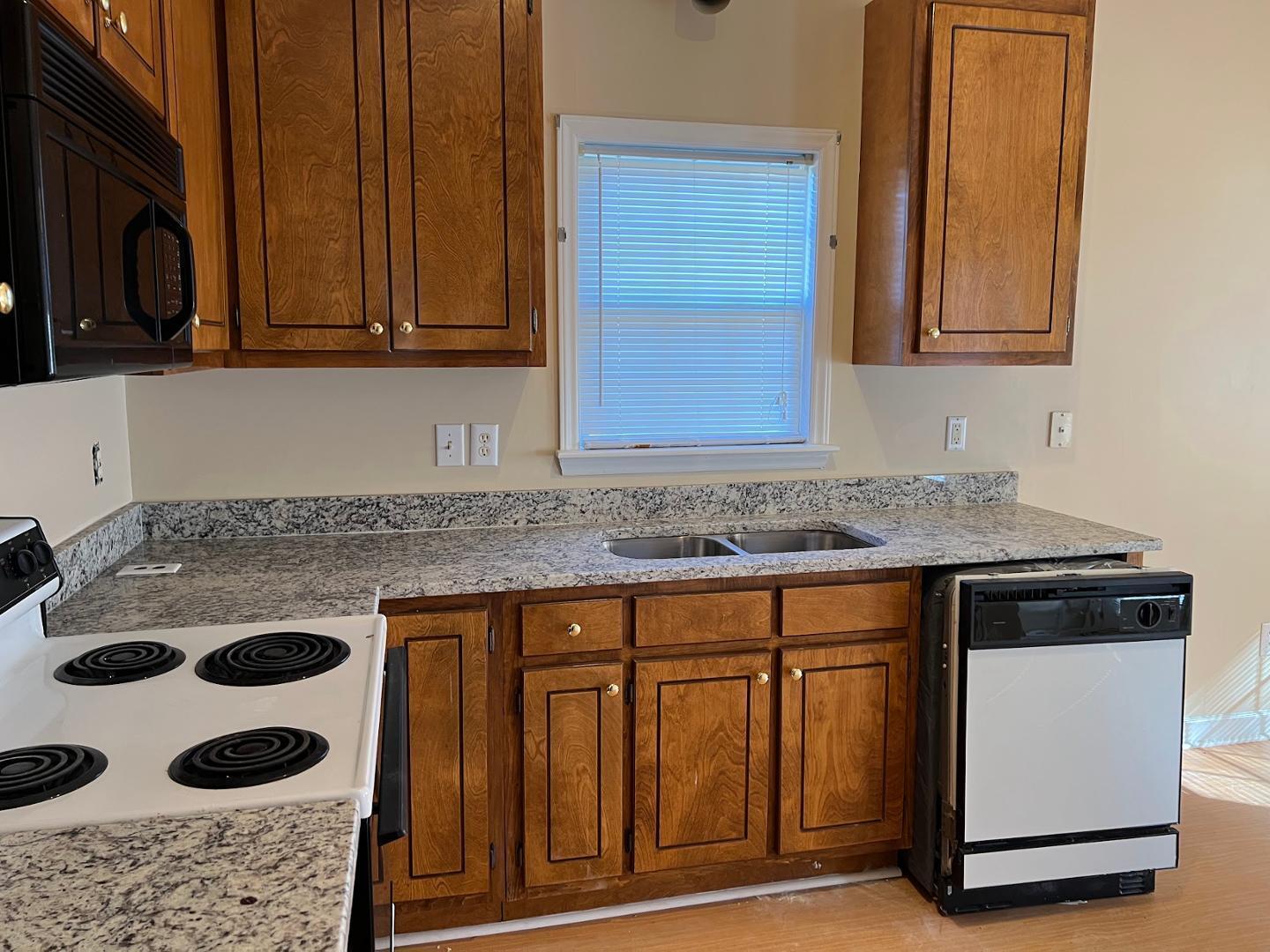 106 Bald Drive Clayton, NC 27520 - Photo 24 of 37 a kitchen with a stove and a sink