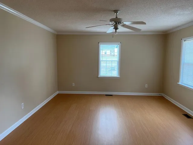 a view of an empty room with closet area