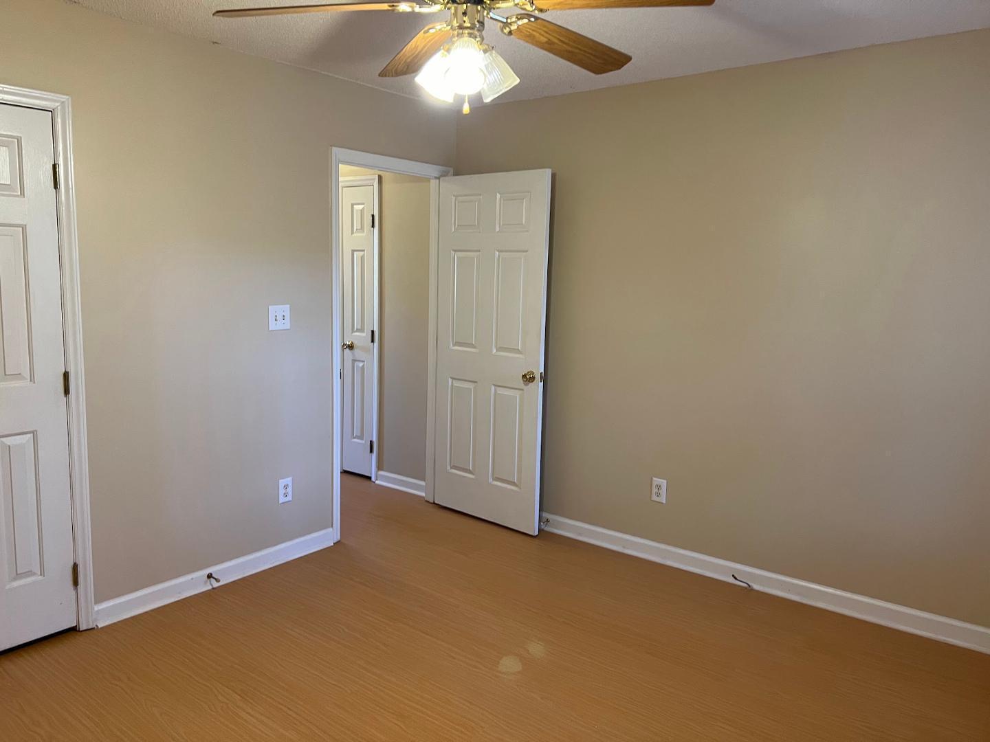 106 Bald Drive Clayton, NC 27520 - Photo 32 of 37 an empty room with a chandelier fan