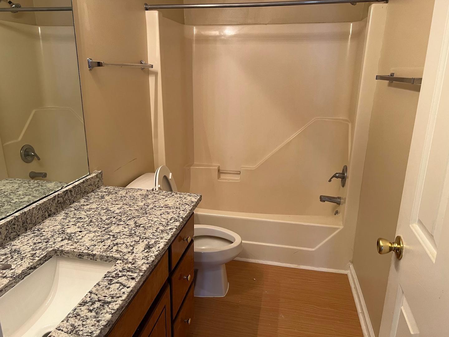 106 Bald Drive Clayton, NC 27520 - Photo 34 of 37 a bathroom with a granite countertop sink toilet and shower