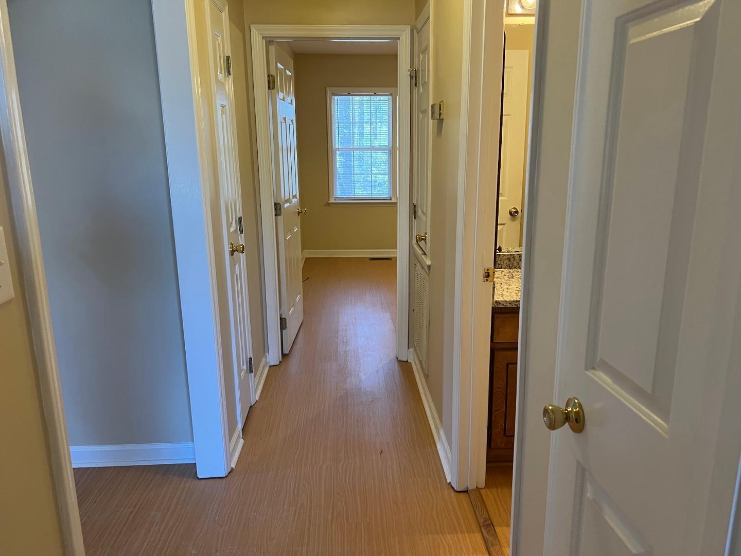 106 Bald Drive Clayton, NC 27520 - Photo 4 of 37 a view of a hallway with wooden floor