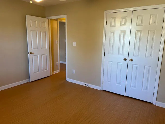 a view of an empty room with entryway