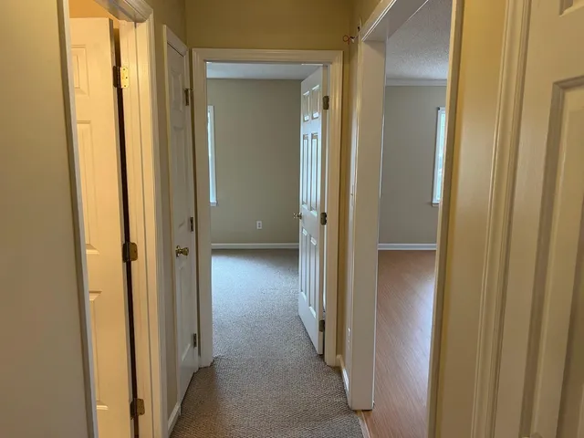 a view of a bathroom from a hallway