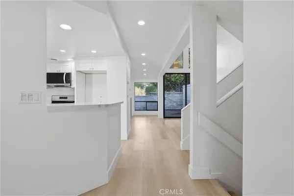 an entryway at livingroom with furniture and wooden floor