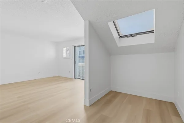 a bathroom with a double vanity sink mirror and bathtub