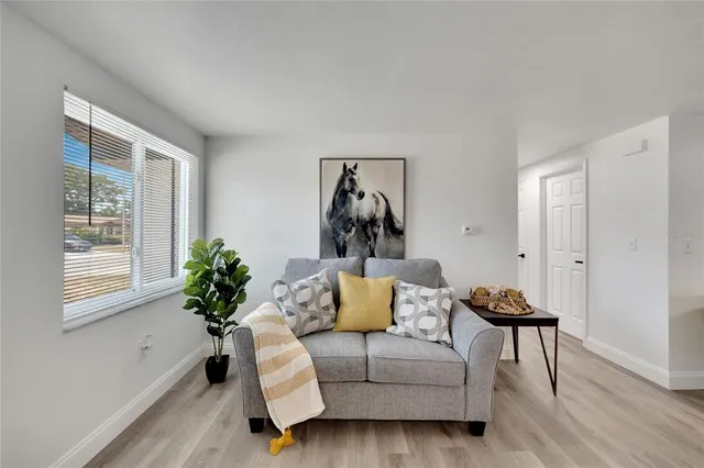a kitchen with stainless steel appliances kitchen island granite countertop a dining table and chairs