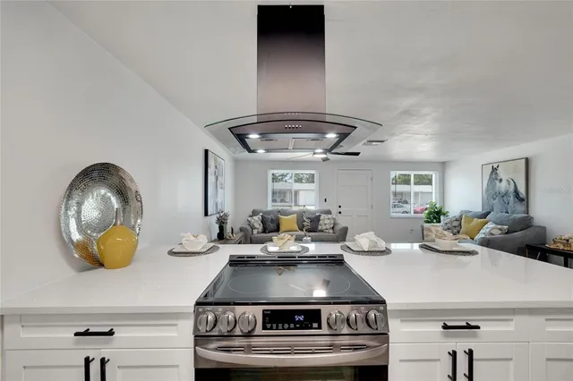 a bedroom with a large bed and a dresser