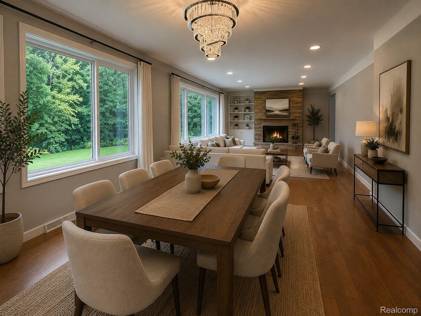 3520 Rayburn Road Bloomfield Hills, MI 48304 - Photo 20 of 26 Open-concept living area with wood-finish flooring, a stone-clad fireplace, built-in shelving, and recessed lighting