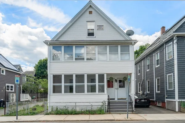 a front view of a house with a porch
