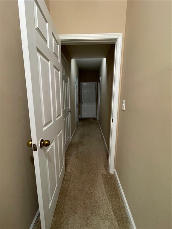 103 Live Oak Court Dallas, GA 30157 - Photo 17 of 25 a view of a hallway with a wooden door