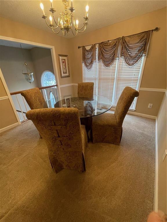 103 Live Oak Court Dallas, GA 30157 - Photo 5 of 25 a bedroom with furniture and a chandelier