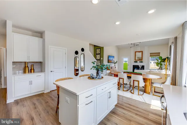a view of a kitchen counter space and wooden floor