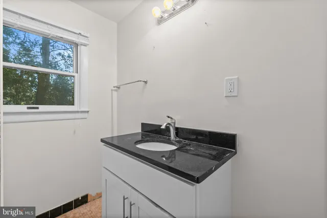 a sink sitting next to a window