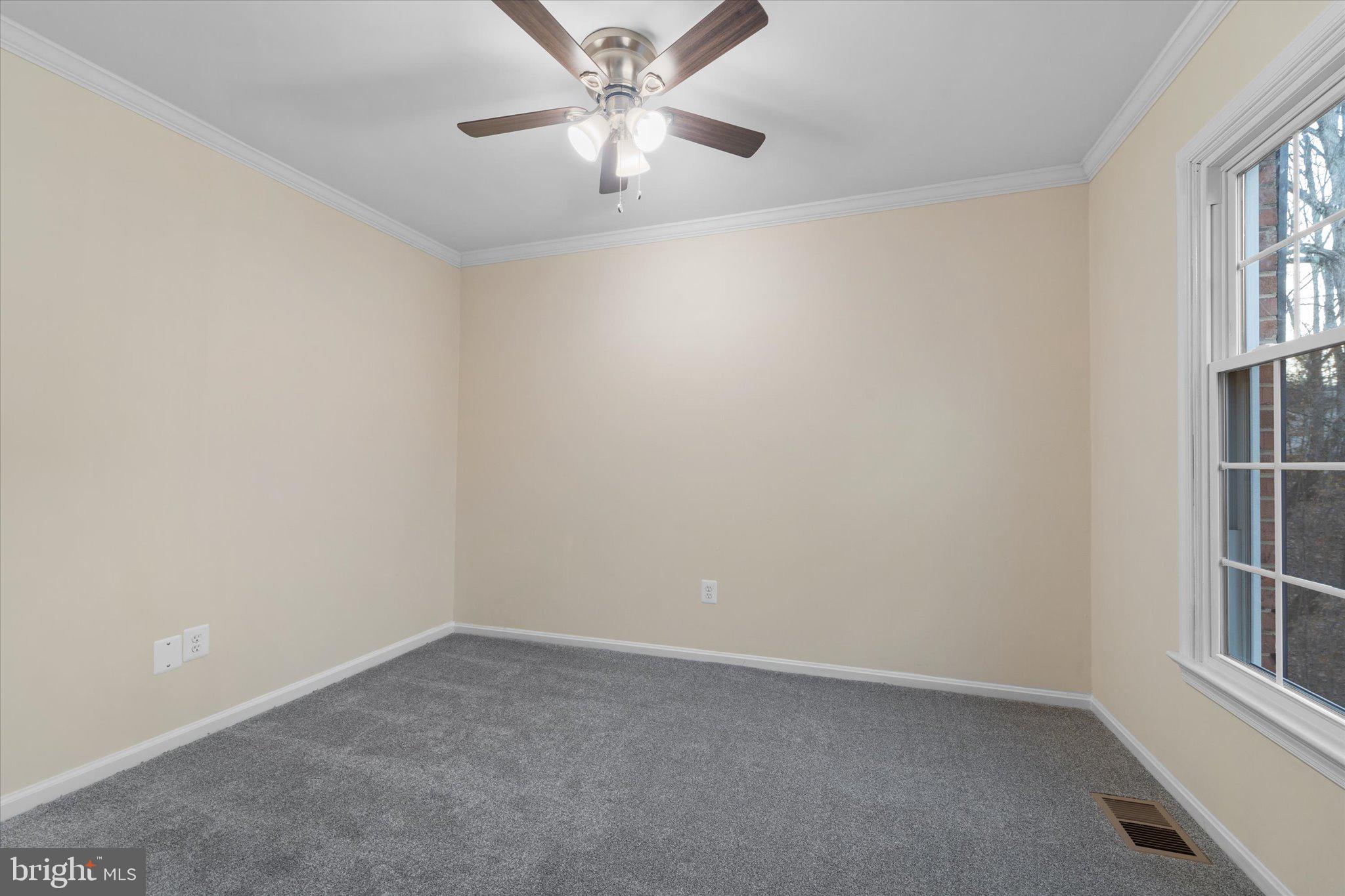 8016 Stillbrooke Road Manassas, VA 20112 - Photo 14 of 41 an empty room with windows and fan