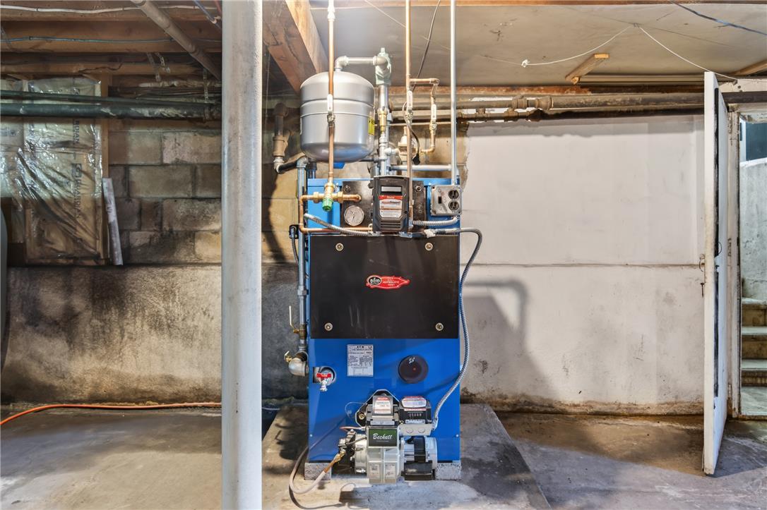 51 Reynolds Road Tamaqua, PA 18252 - Photo 46 of 71 Essential utilities in this basement feature a robust heating system and sturdy concrete block walls.