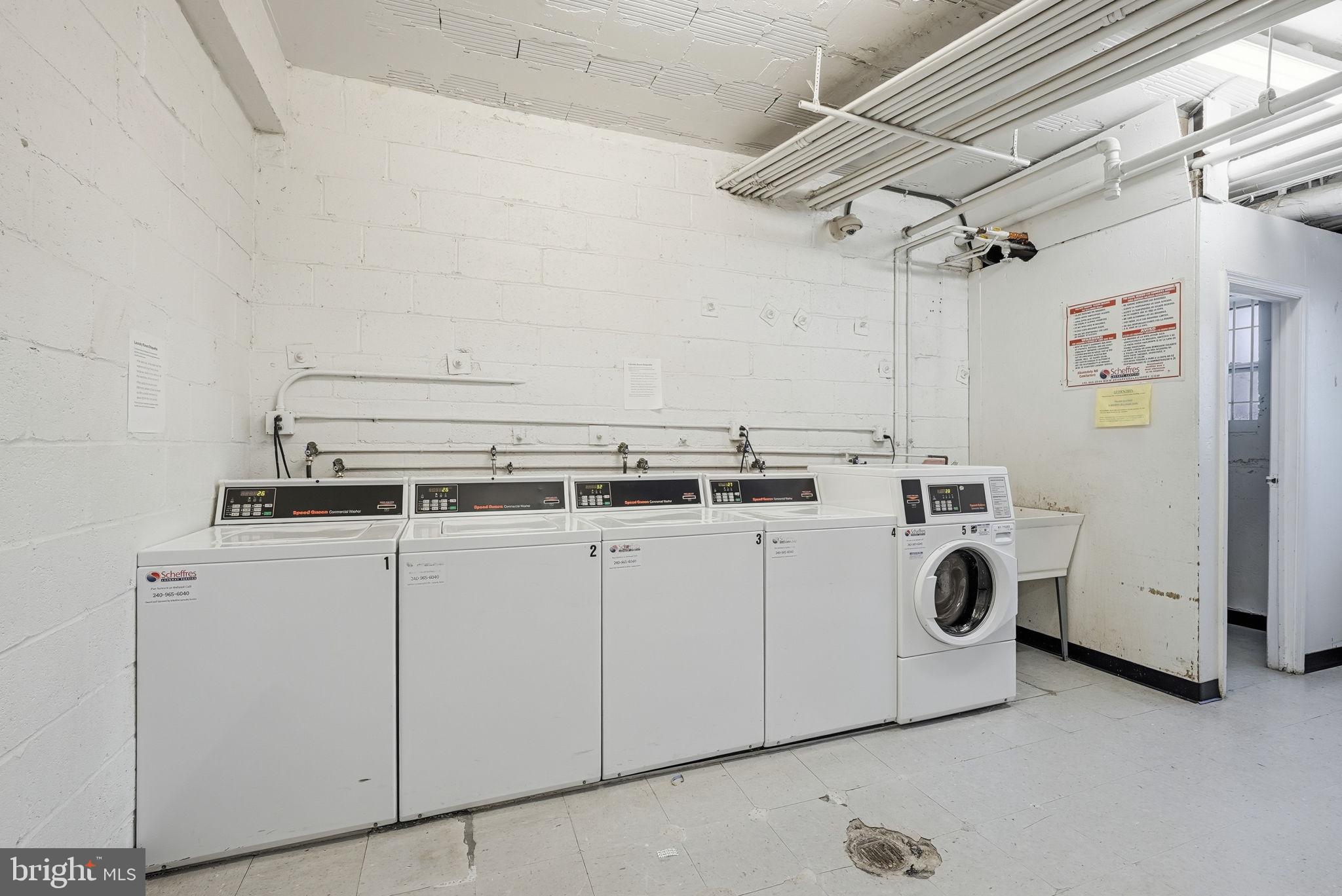 4100 W Street Northwest, Unit 203 Washington, DC 20007 - Photo 13 of 18 a utility room with dryer and washer