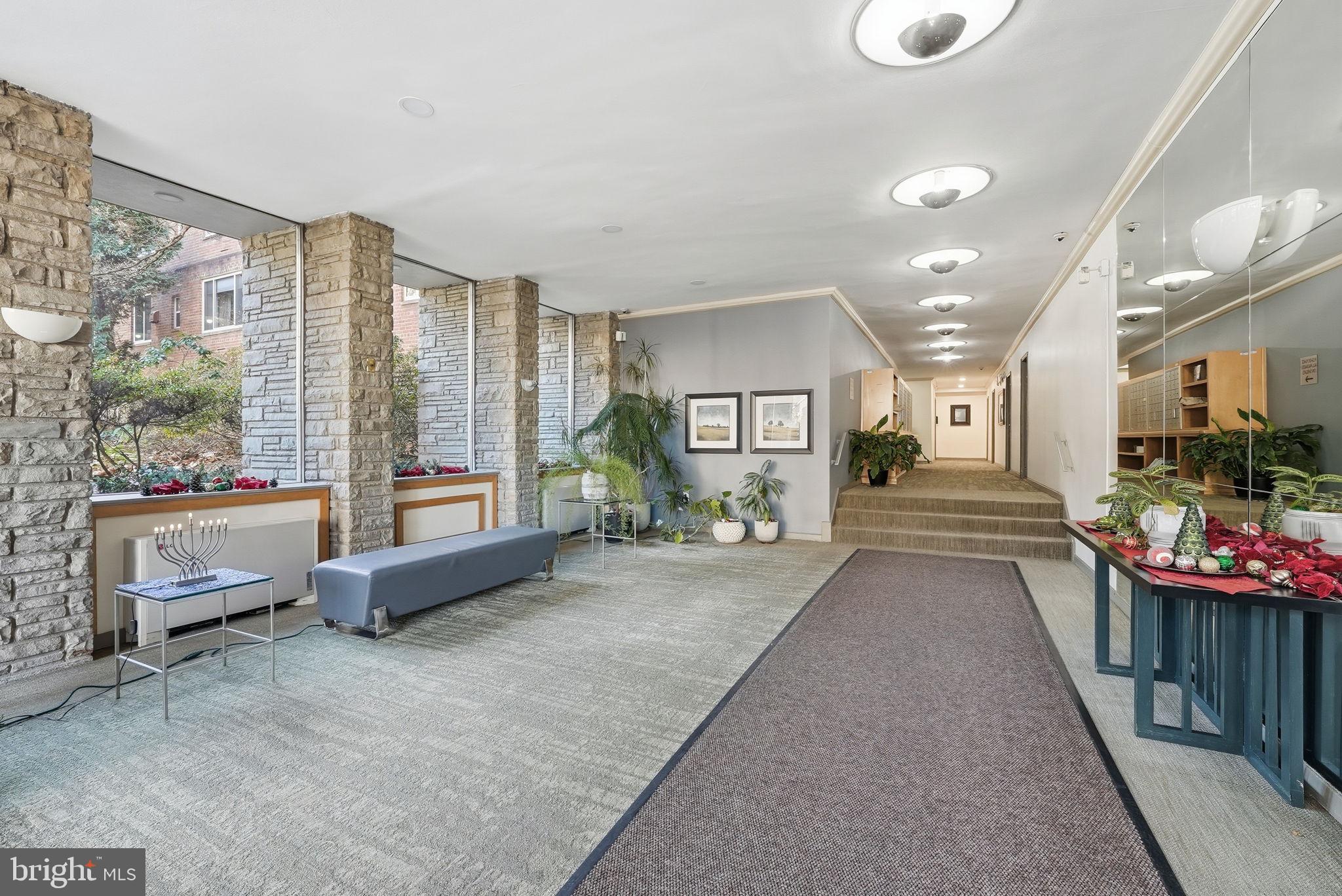 4100 W Street Northwest, Unit 203 Washington, DC 20007 - Photo 15 of 18 a living room filled with furniture and a table