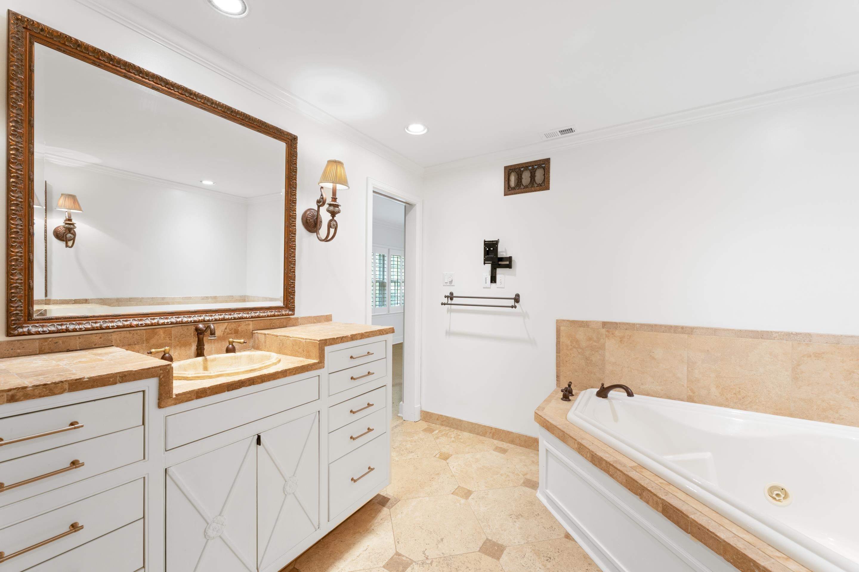 5360 Normandy Road Memphis, TN 38120 - Photo 13 of 40 Bathroom with travertine stone whirlpool tub, double vanities and walk-in shower